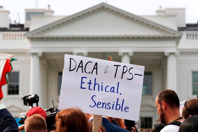 The Latest: Supreme Court to hear arguments on ending legal protections for Haitian/Syrian migrants