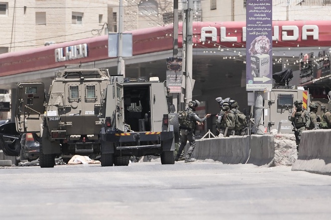Israel's military said a Palestinian family could bury their father. Then the settlers arrived