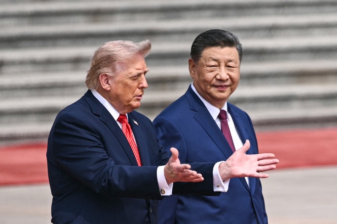 Trump-China visit latest: Xi welcomes US president with gun salute and military display as talks begin in Beijing