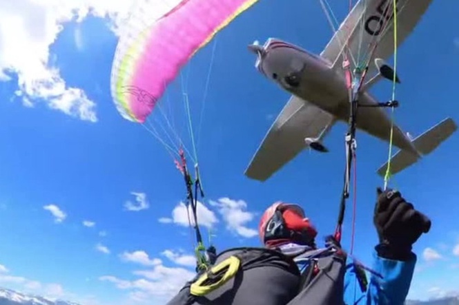 Plane crashes into paraglider and sends her spiralling through the air