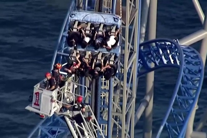 Rollercoaster riders stuck on 100ft vertical hill for hours after malfunction