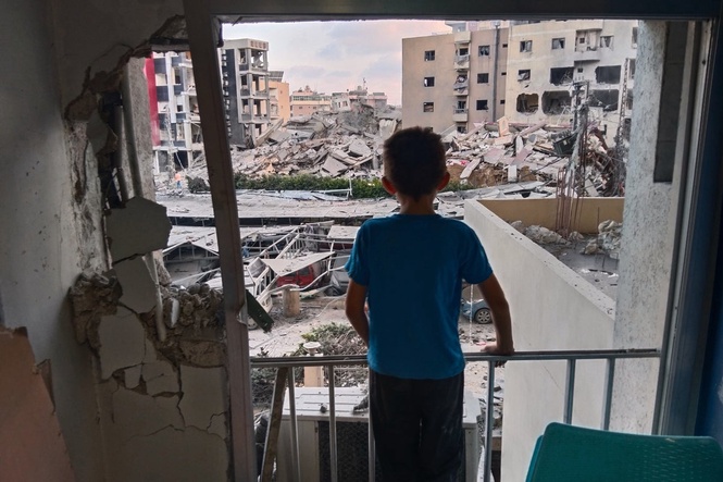 A Lebanese hospital is in ruins and people flee a Beirut suburb after Israel's threat, in photos