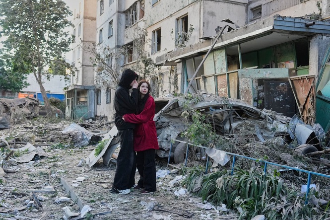 Russian attack on Ukraine capital kills at least 3 and traps others in damaged buildings