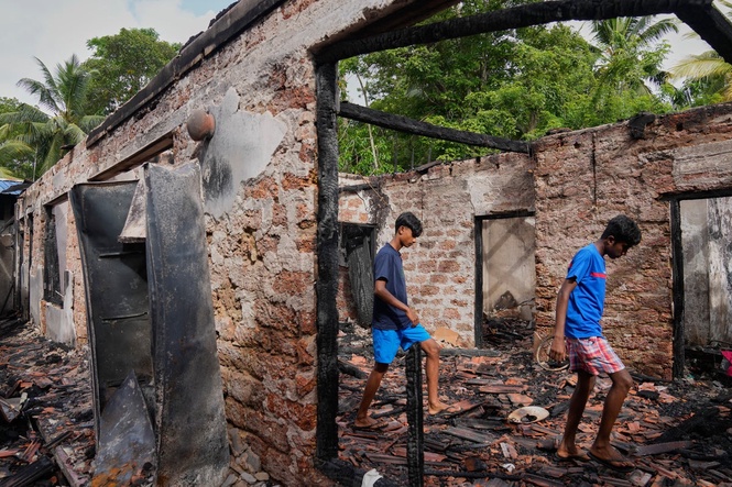 Survivors from a burned Sri Lankan nursing home relocate, in photos