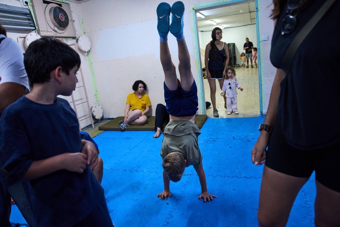 After morning of sirens, Israelis fall back into well-worn war routines