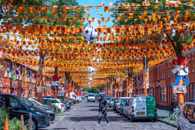 A street in The Hague is drenched in orange as Netherlands soccer fans celebrate the World Cup