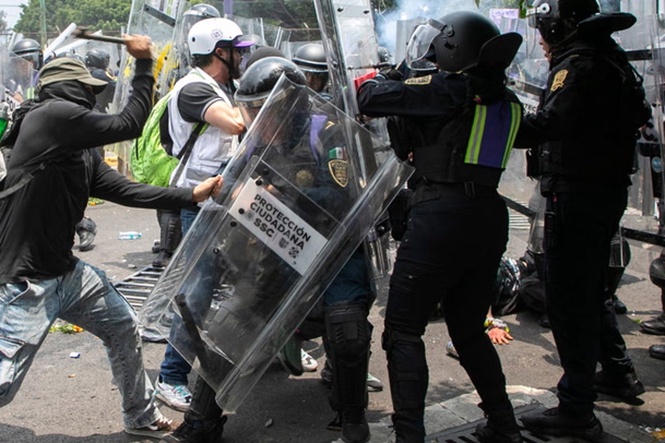 Protesters in Mexico clash with riot police outside stadium during World Cup opener