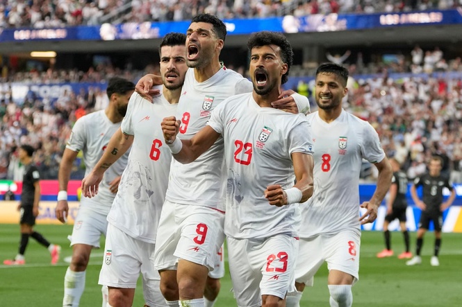 Iran opens its politically charged World Cup by playing to a 2-2 draw with New Zealand