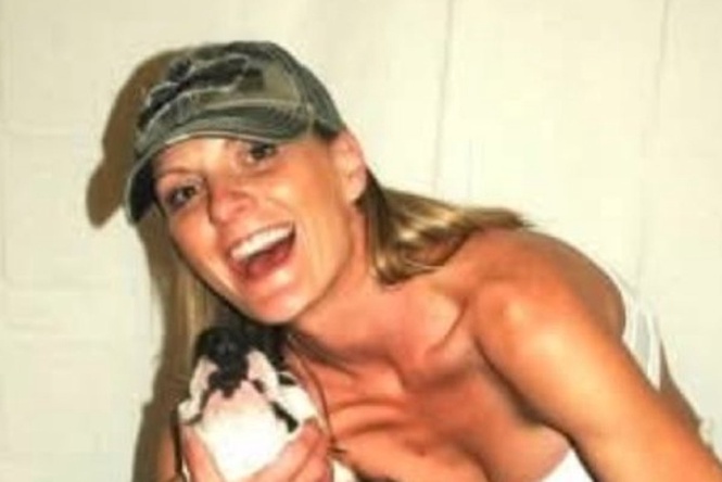 A woman was mauled to death by her neighbor’s pit bulls. Her partner is now accused of killing the pets she left behind
