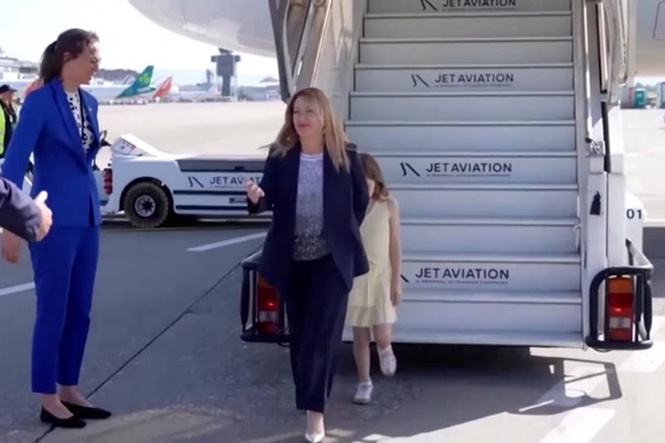 Giorgia Meloni’s camera-shy daughter hides behind mother as pair arrive for G7 summit