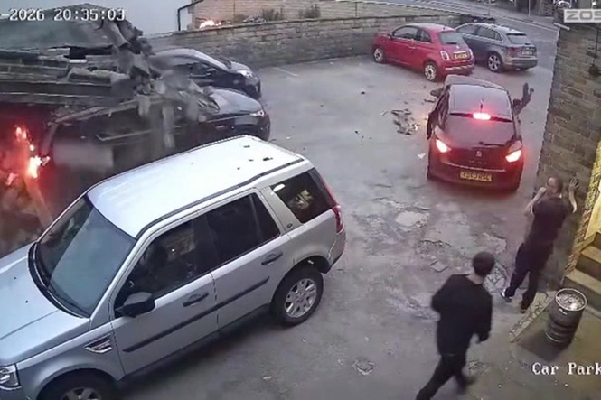 Moment SUV rams into two cars before smashing into pub car park building