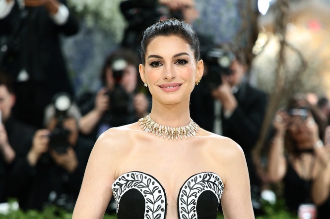 Anne Hathaway expecting third child as she reveals baby bump in surprise video