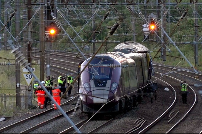 Train driver killed and dozens seriously injured as two trains collide near Bedford