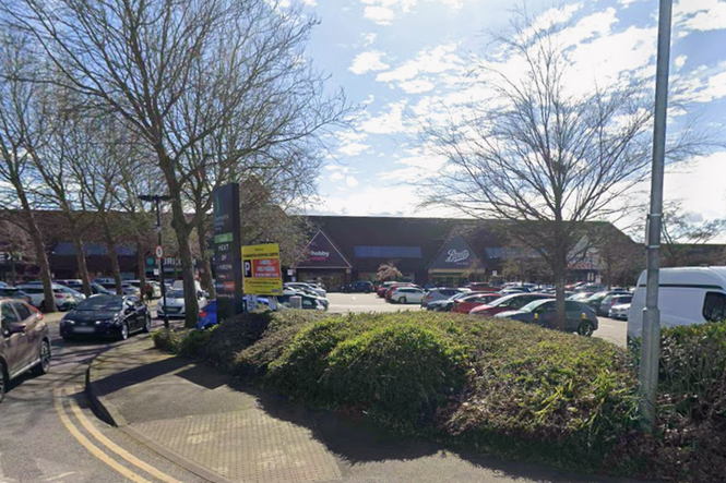 Roof caves in as shopping centre engulfed in flames