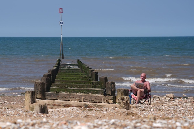 June temperature record broken as UK swelters in exceptional heat