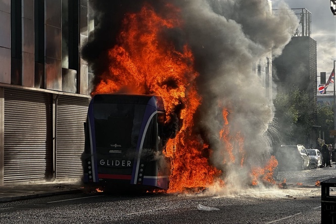 Man appears in court charged over bus fire during Belfast riots