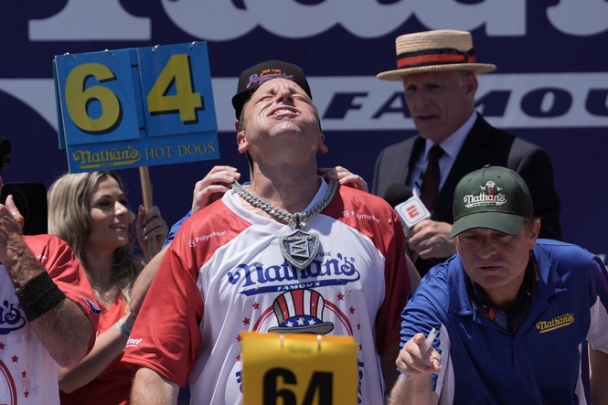 Joey Chestnut wins Nathan’s hot dog eating contest by stomaching 66 franks in 100-degree heat