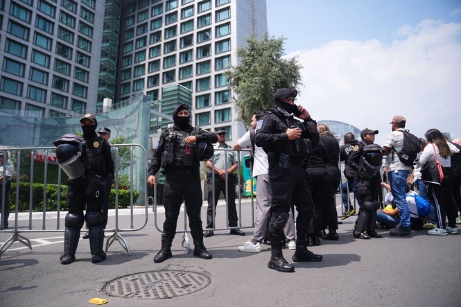 100 riot police guard England hotel as team receive hostile reception in Mexico