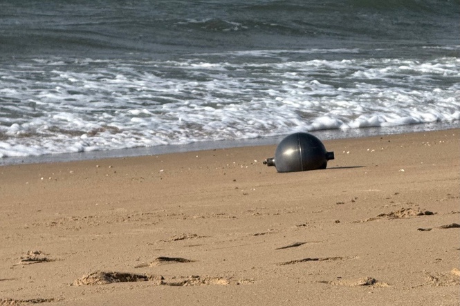 Strange balls found on Queensland beaches could be toxic ‘space debris’, experts warn