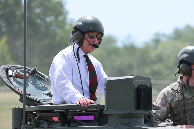 Heavy metal: King rides British Army tank in visit to regiment