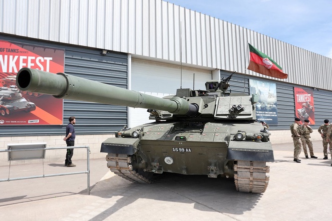 King Charles takes trip in a tank during British Army visit
