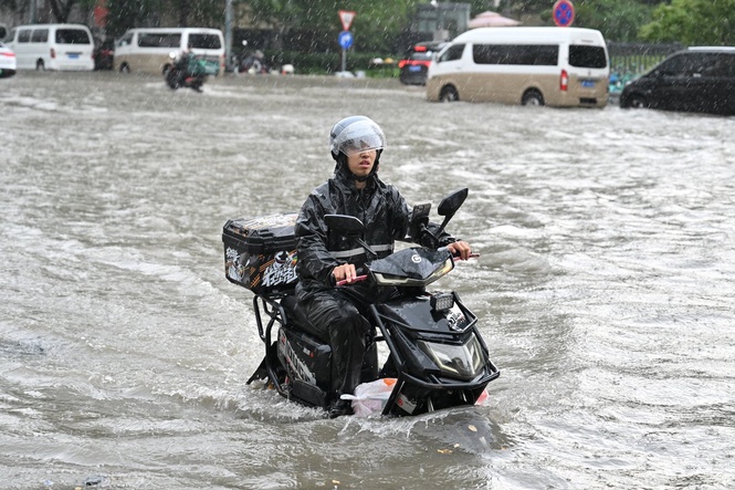 Landslide kills 21 people as storms and heavy rains wreak havoc in China