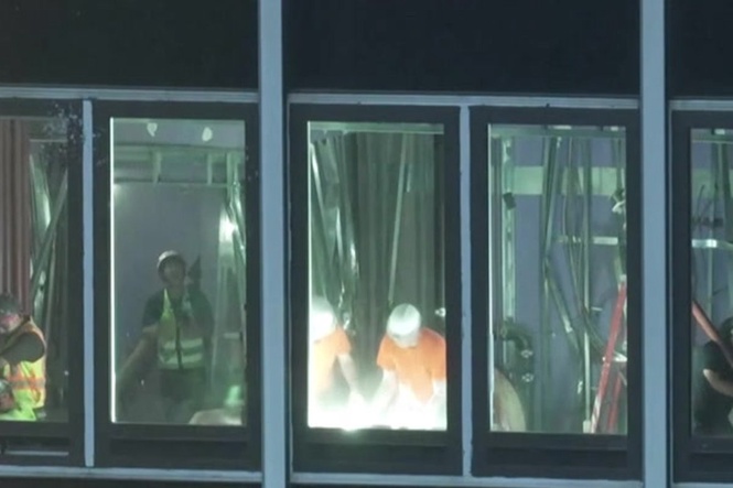 Crews work to reinforce buckled support beams at NYC high-rise