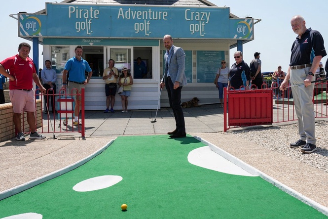Prince of Wales plays crazy golf after ride on funicular