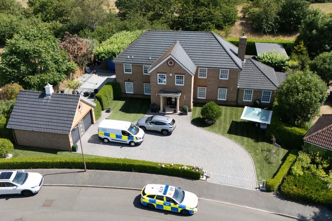 Man wanted over death of wife and daughters in Britain arrested in South Africa