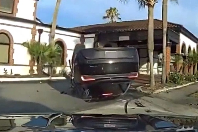 Police dashcam captures moment speeding Tesla flips in deadly Florida crash that killed scooter rider