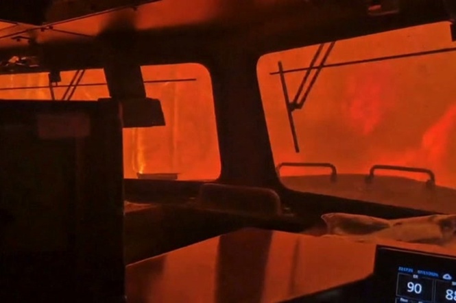 Intense flames surround train crew as wildfire rages in Canada
