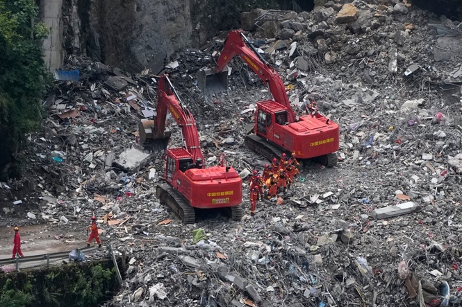 Rescuers in China search the rubble for survivors of landslide that killed 8 and left 34 missing