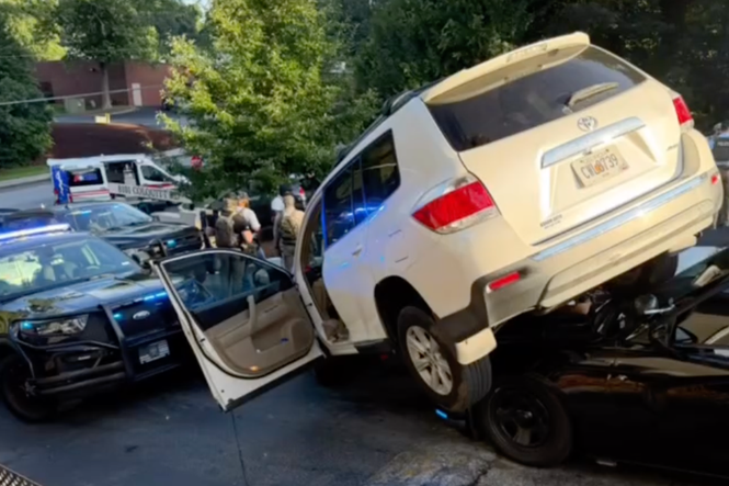 Wild moment suspect’s vehicle ends up on top of police car during chase