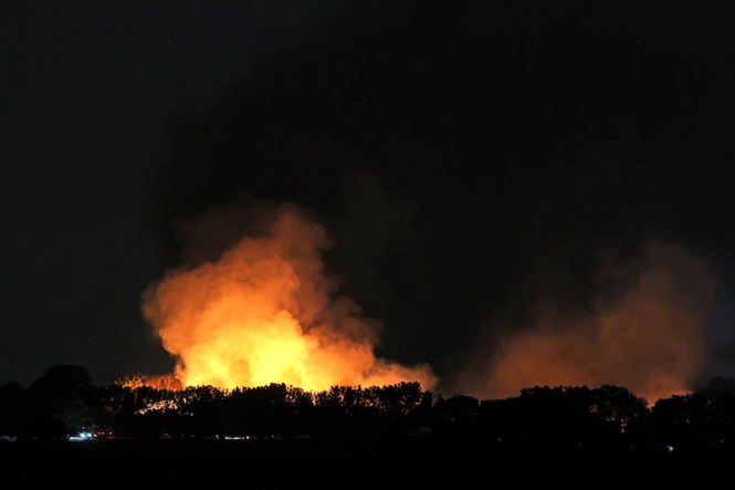 Twenty firefighters taken to hospital and three fire engines destroyed after fertiliser explosion causes huge blaze