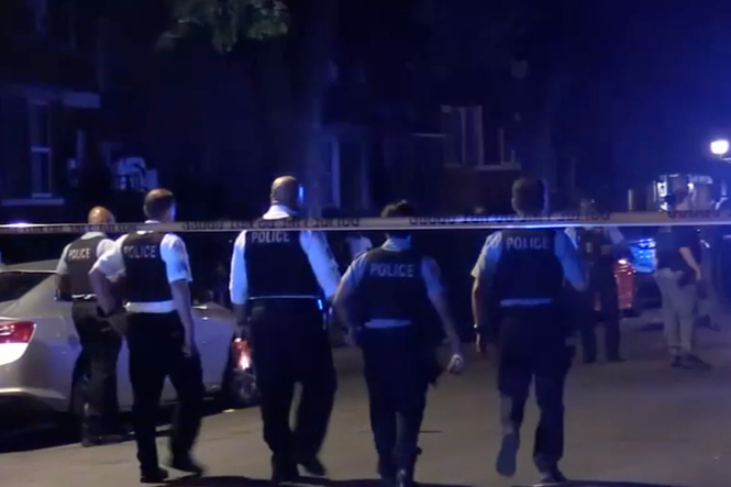 Gunman on the run after bullets rip through Chicago crowd, leaving 2 fighting for life