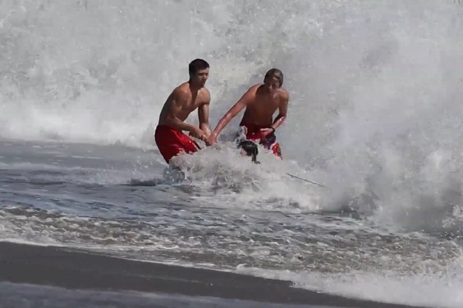 Dramatic rescue sees lifeguards battle terrifying waves to save boy off California