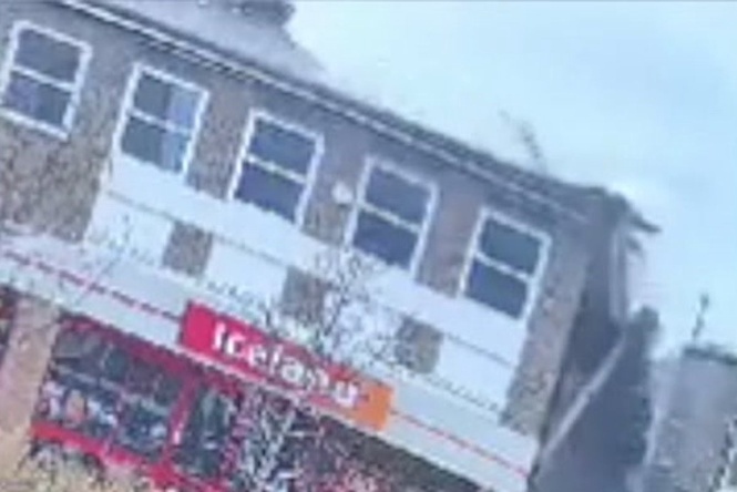 Masonry rains down on busy high street as roof above Iceland supermarket collapses