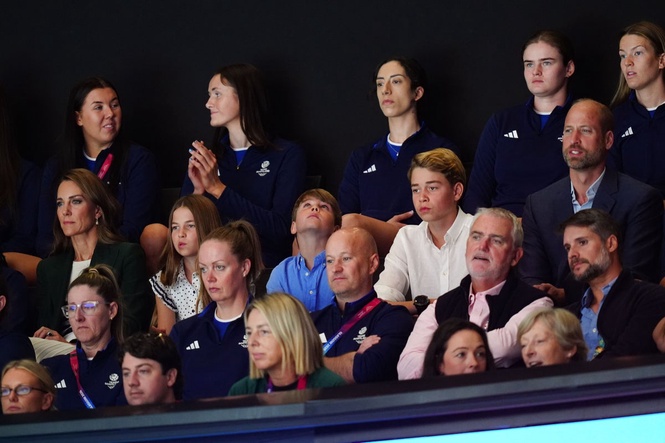 William and Kate joined by children as they watch Commonwealth Games netball