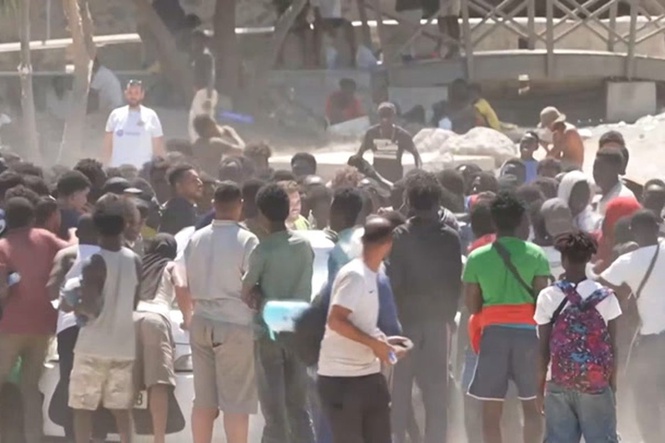 Migrants brawl over food and water aid in Ceuta after border surge
