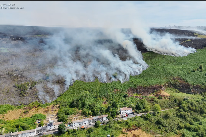 Deliberate blazes started on mountain in Wales as huge wildfire rages