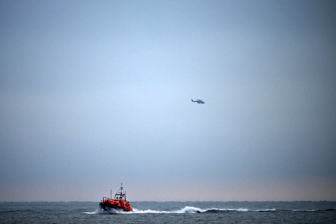Boat carrying 157 migrants capsizes after catching fire in English Channel