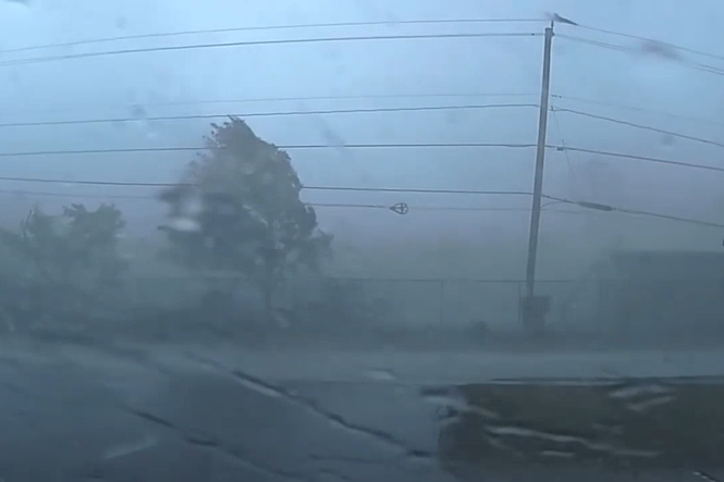 Police officer trapped in the middle of tornado caught on terrifying dashcam