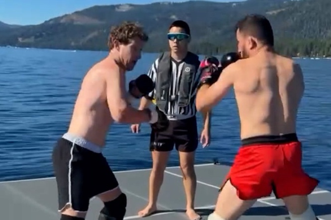 Shirtless Mark Zuckerberg spars with UFC champion in middle of lake