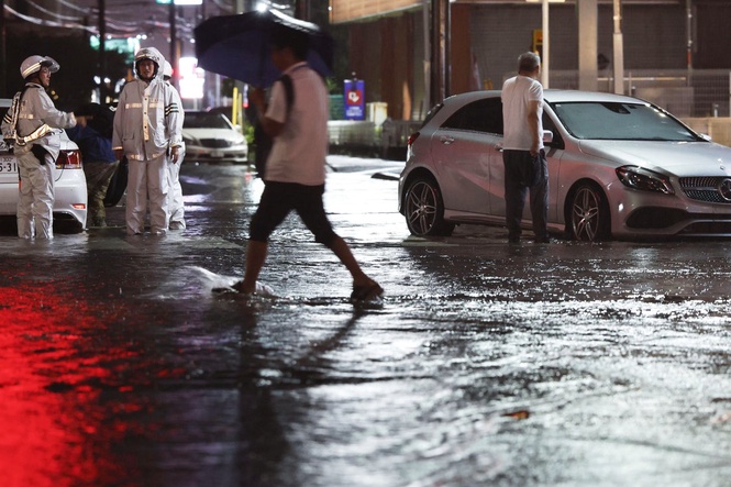 Heavy rain causes flooding near Tokyo that kills 4 and disrupts train and air travel