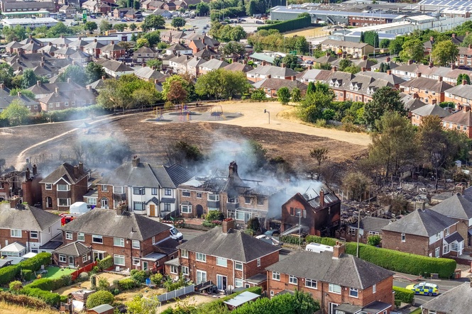 Man and woman arrested over grass fire that damaged four houses