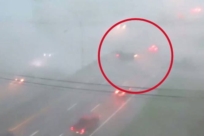 Watch as car is lifted up and blown across highway by fierce winds as powerful storm hits Ohio
