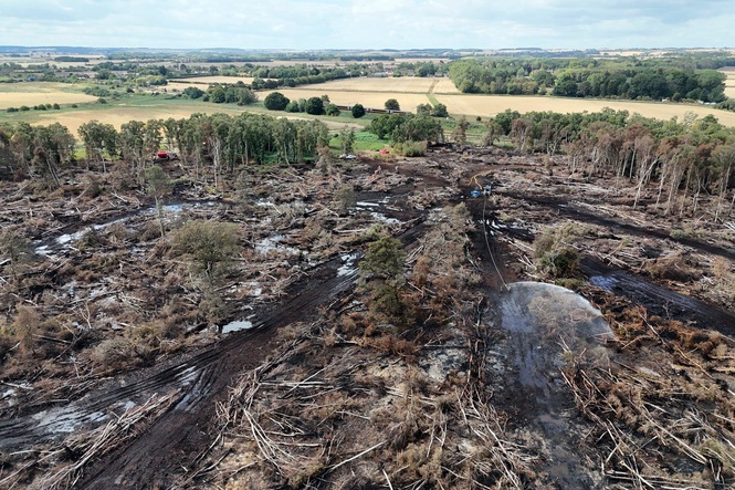 Aerial photos show devastating aftermath of Holme Fen blaze as firefighters remain after 11 days