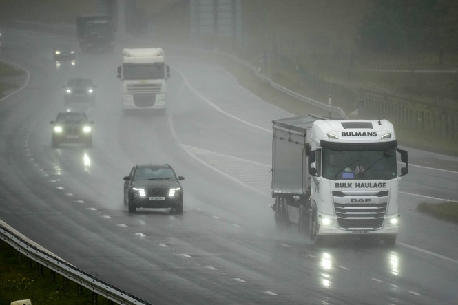 UK hit with heavy rain and thunderstorms as Met Office warns of flash flooding
