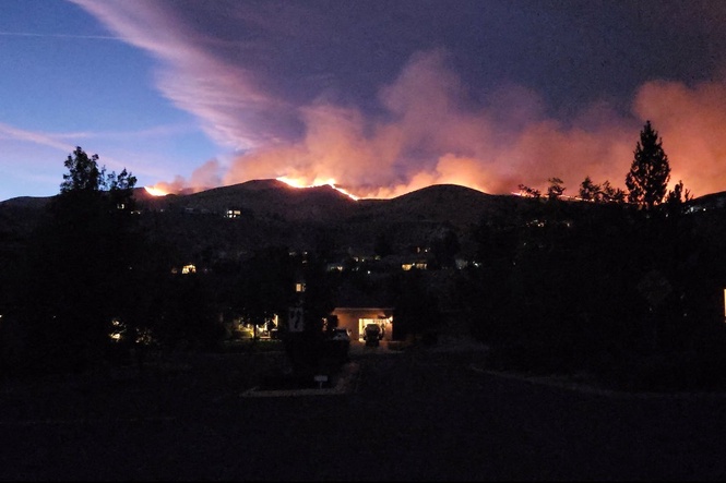 Fast-moving wildfire in Nevada forces nearly 90,000 to evacuate was human caused, sheriff says
