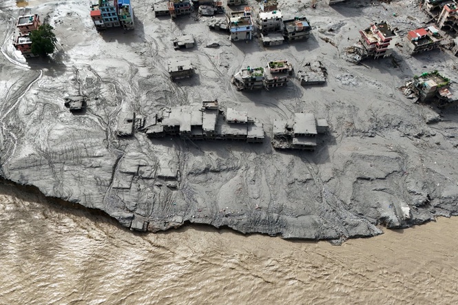 Terrifying CCTV shows people fleeing seconds before floodwaters engulf Nepal-Tibet border crossing